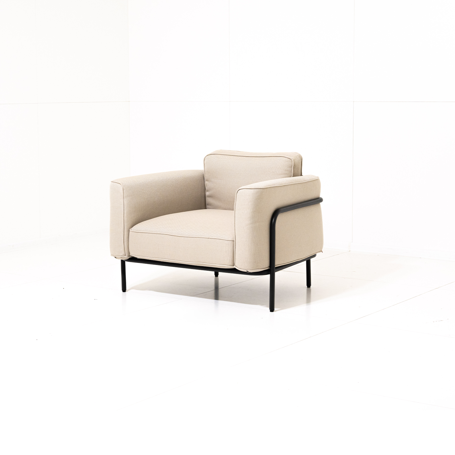 Beige armchair with black frame on a white background